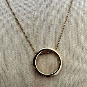 Gold tone circle pendant necklace